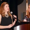 Aimee Dexheimer (left) receives the Organization of the Year Award for the Navy Marine Corps Relief Society.